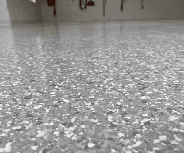 Gray flake epoxy garage floor close-up